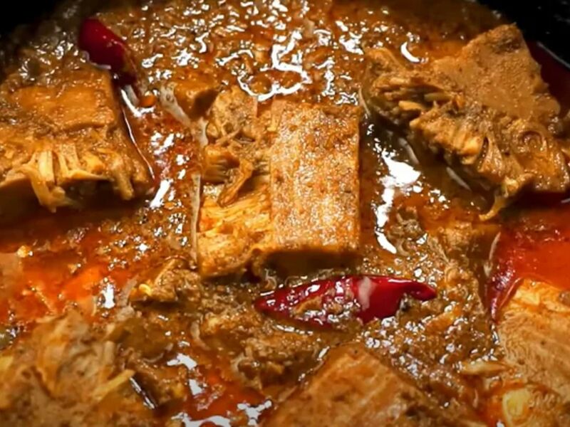 Chunks of beef in a rich red pepper stew with dried chillies